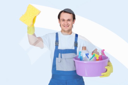 Local cleaner working in a kitchen and living area in NW6