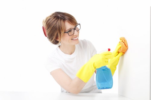 Window cleaner working on a residential building in NW6
